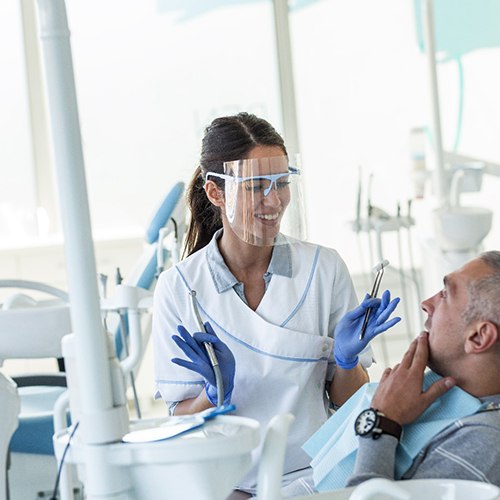 Dentist explaining treatment to patient