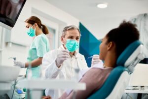 patient talking to the dentist